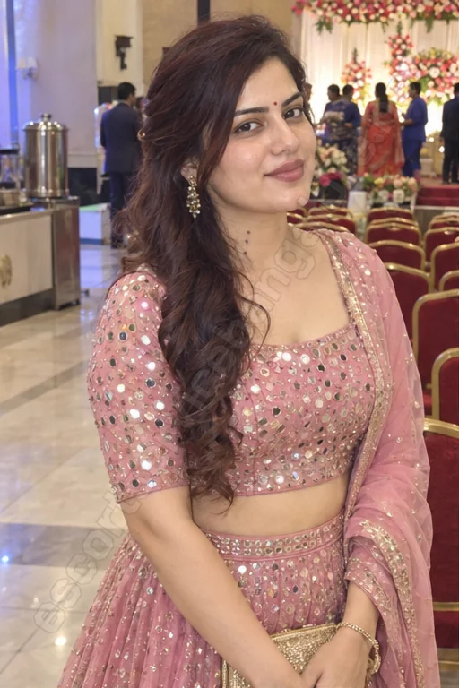 Daksha in a pink lehenga at a wedding hall in Malleshwaram